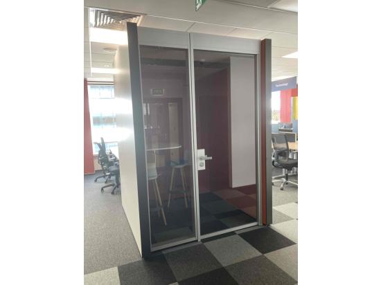 Small glazed acoustic booth