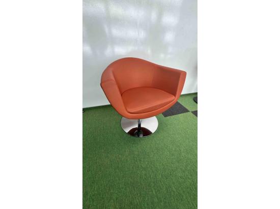 Orange armchair on silver leg