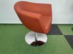Orange armchair on silver leg