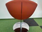 Orange armchair on silver leg