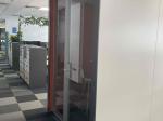 Small glazed acoustic booth
