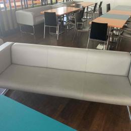 Grey sofa with armrests