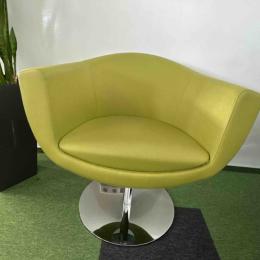 Green armchair on silver leg